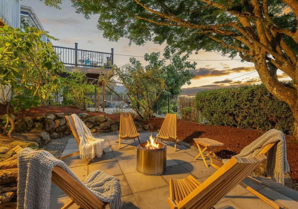 Evening glow from the backyard fire pit area, tucked into the trees.