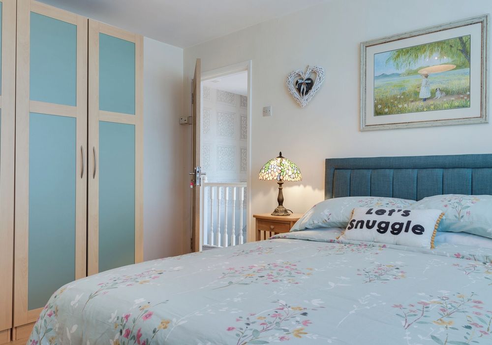 Relax in a comfortable double bed with soft linens and calming décor.