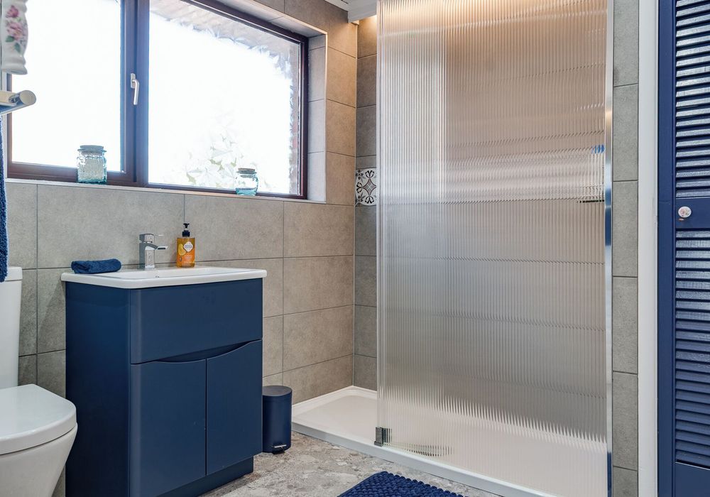 Clean, modern bathroom with essentials provided for a stress-free stay.