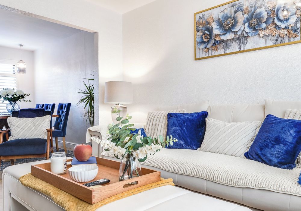 Comfortable seating and natural light make this living room your home away from home.