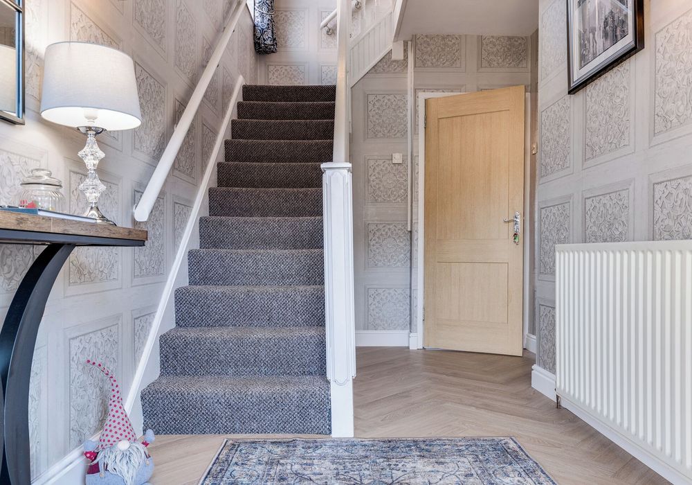 Stairway to comfort and cozy bedrooms upstairs.