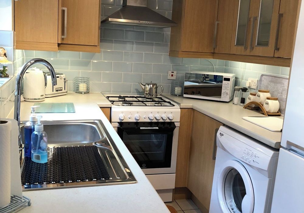 A cozy kitchen with everything you need to whip up meals.