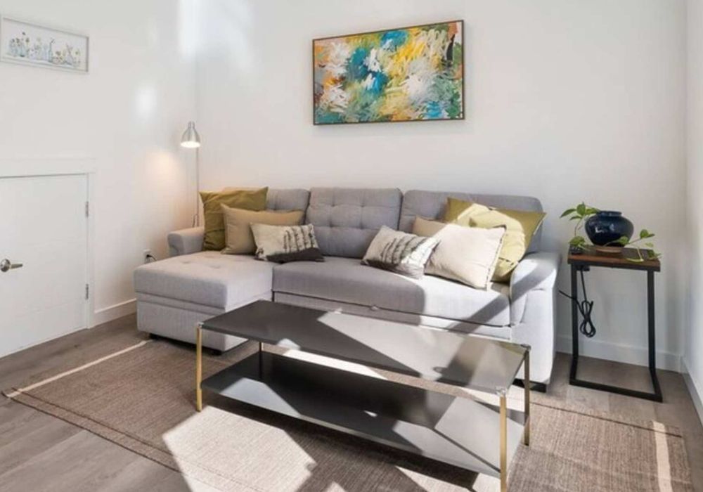 Stretch out on the sectional or read by the window. Open layout connects easily to kitchen and dining.