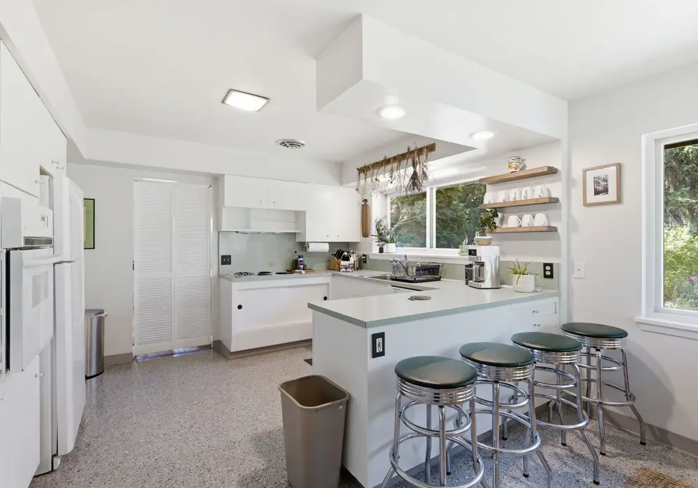 A bright, functional kitchen with bar seating for four.
