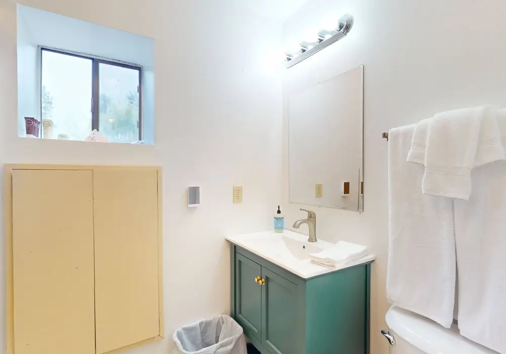 Freshen up after a day at the beach in this clean, comfortable bathroom.