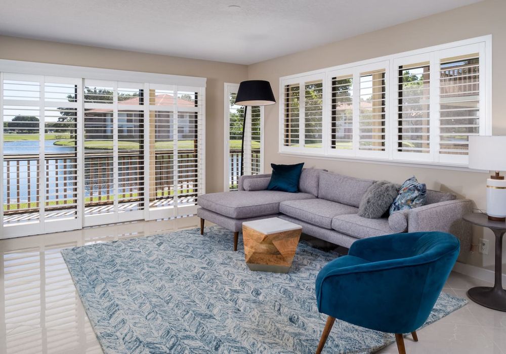 Spectacular golf course and water views from the living room featuring a smart tv