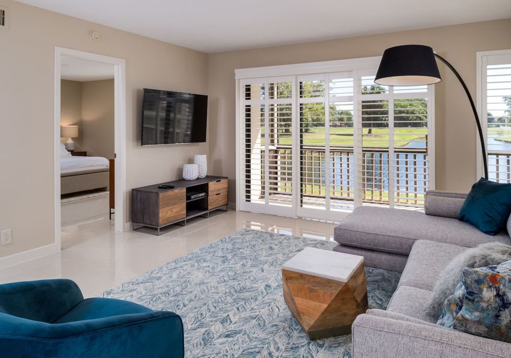 Spectacular golf course and water from the living room featuring a smart tv