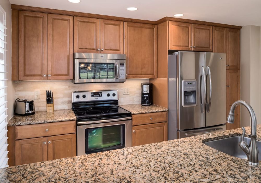 Gourmet kitchen with granite counter tops and stainless steel appliances