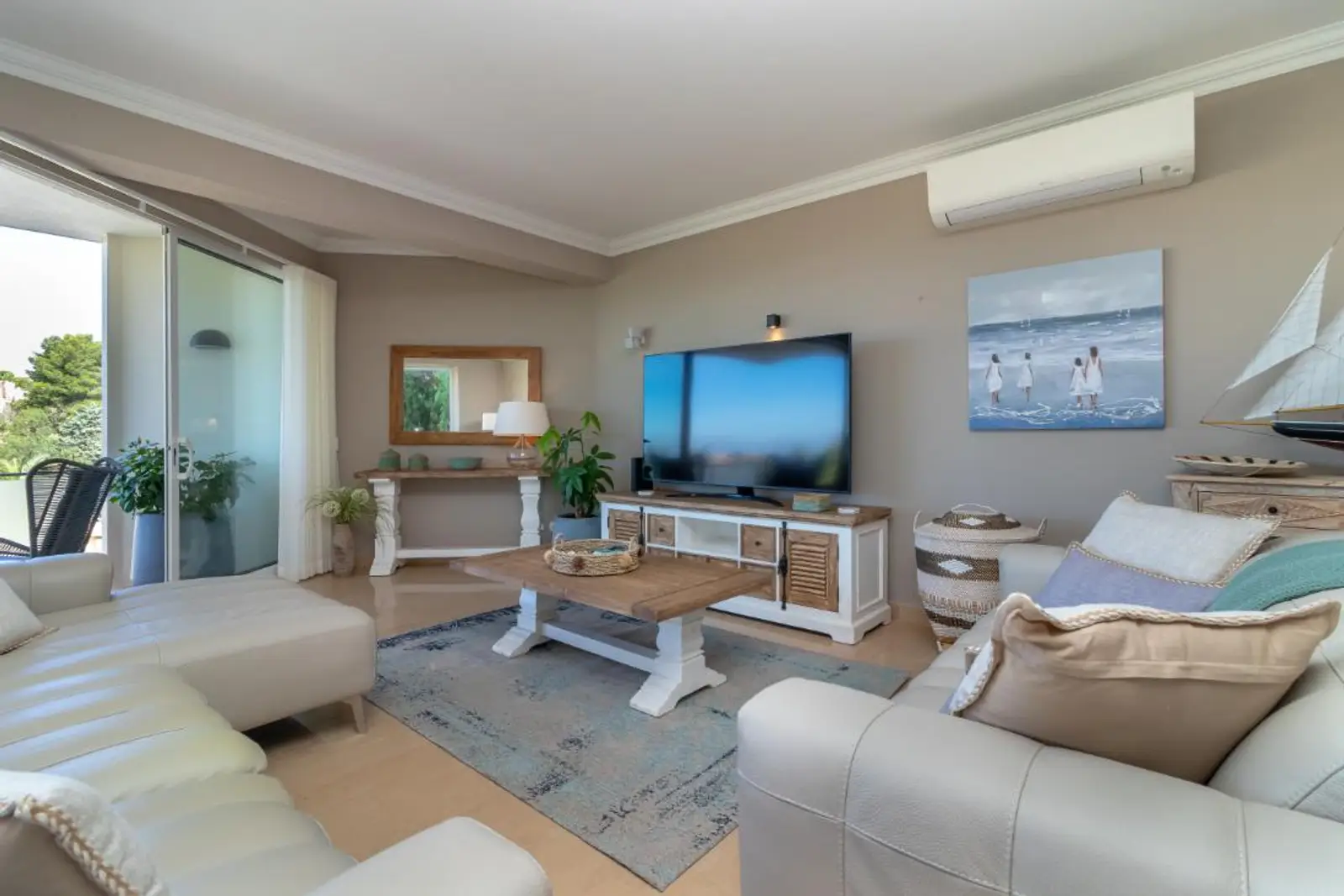 Open-plan living and dining room with wooden dining table seating six
