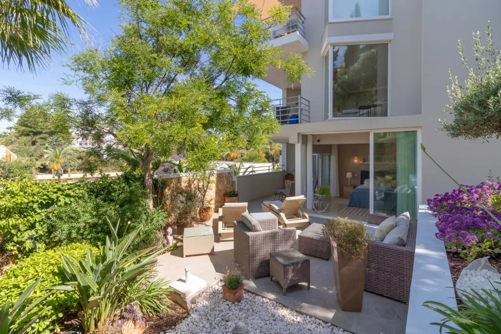 Exterior view of the apartment terrace within the planted gardens