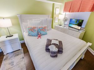 - Cozy queen size bed in a beach inspired bedroom designed for relaxation - Soft lighting, tropical décor & fresh linens create a peaceful retreat after a day in the sun - Enjoy your favorite shows on the TV or unwind with the calming coastal ambianc