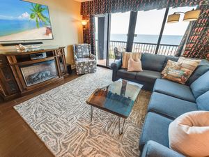 - Oceanfront living room with a spacious sectional, perfect for gathering - Enjoy a warm ambiance with electric fireplace & breathtaking views through windows - Relax with your favorite shows on the smart TV or step onto the balcony to feel the cool