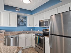 - Fully stocked kitchen with stainless appliances   - Granite counters and white cabinets for easy meals   - Prepare beach snacks or cook dinner after exploring