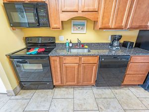 - Fully equipped kitchen featuring modern appliances and sleek granite countertops - Cook your favorite meals with ease using the oven, microwave, and a coffee maker - Plenty of cabinet space for storage, making it ideal for extended stays