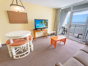 - Wake up to stunning ocean views from the balcony in this beachfront retreat - Comfortable living area with a smart TV, dining space, and easy access to the beach - Perfect for a relaxing stay near restaurants, entertainment, and local attractions