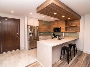 Prepare meals with ease in the modern, fully-equipped kitchen, complete with top-tier appliances and sleek finishes.
