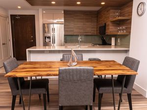 Whether you're enjoying takeout or a homemade meal, the dining area offers a cozy and inviting space for any occasion.