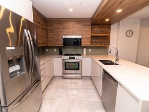 Prepare meals with ease in the modern, fully-equipped kitchen, complete with top-tier appliances and sleek finishes.