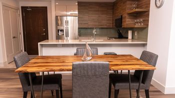 Whether you're enjoying takeout or a homemade meal, the dining area offers a cozy and inviting space for any occasion.