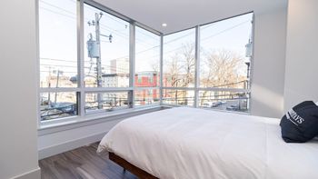 Sleep in Luxury – Queen Bed Framed by Panoramic City Views.