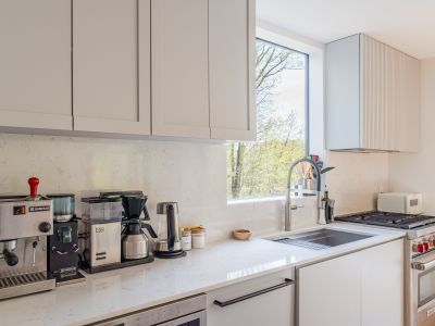 A picture window thoughtfully placed above the kitchen sink.