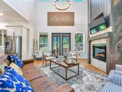 The living room is centered around the luxury fireplace and flat screen tv.
