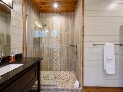 The private bathroom has a walk-in shower.