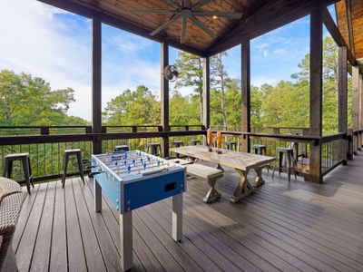 The outdoor amenities don't stop there...challenge your crew to a foosball match surrounded by views of the forest.