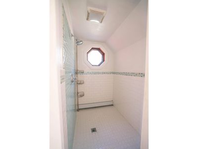 Separate shower room and powder room on 1st floor between kitchen and living room