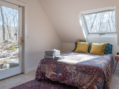 The queen bed in the loft bedroom.