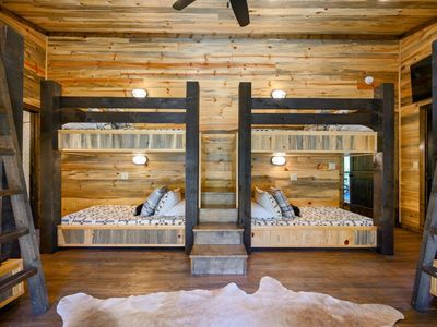 Bunk room with 2 queen beds, 2 full-size beds, 4 twin bed.s