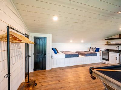 This bunk room features 2 full beds and 1 queen sleeper sofa!