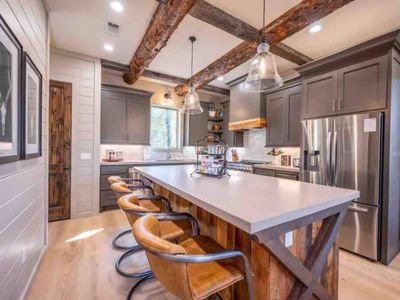 The fully equipped kitchen has additional seating at the bar top!