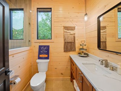 Perfectly situated just off the bunk room, this convenient full bathroom features crisp finishes and a spacious walk-in shower—ideal for keeping everyone upstairs refreshed and ready for adventure.