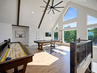 Upstairs takes you to the loft/game room. Futon not photographed.