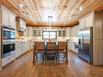 The kitchen with updated appliances and additional seating.