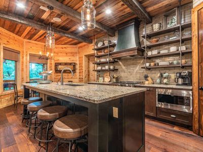 4 additional seats can be found at the bar top.