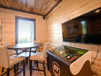 Arcade games and a table for cards.