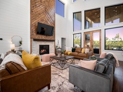 The living room with matching couches and lounge chairs!