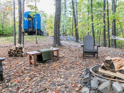 Firepit with cozy Adirondack chairs.