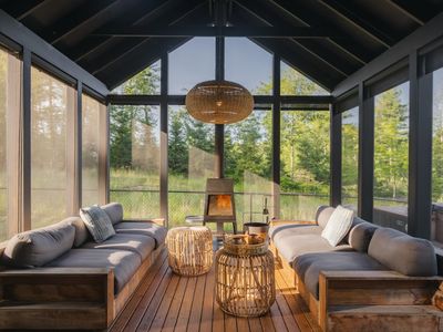 Pool House lounge area with wood burning stove.