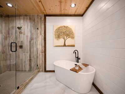 An oversized soaking tub and large walk-in shower.