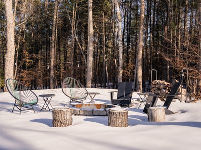 Cozy up by the fire pit among the trees