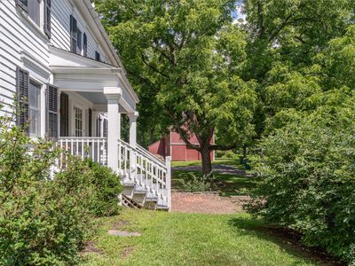 Views of the sweeping property, from the front porch to the barn beyond.