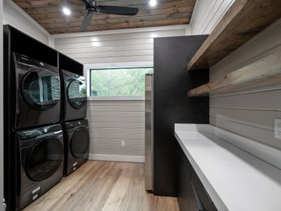 Oversized laundry room with additional full size fridge!