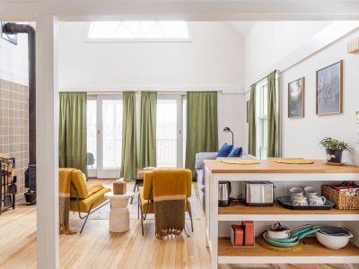 The sun-filled living room of the guest house.