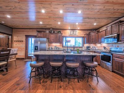4 additional seats can be found at the bar top in the kitchen.