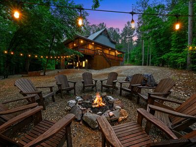 A fire pit with Adirondack chairs sits out back.