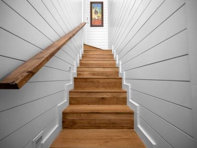 Upstairs leads to the bunk room/Queen suite.