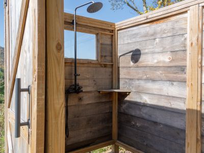 Peering into the outdoor shower.
